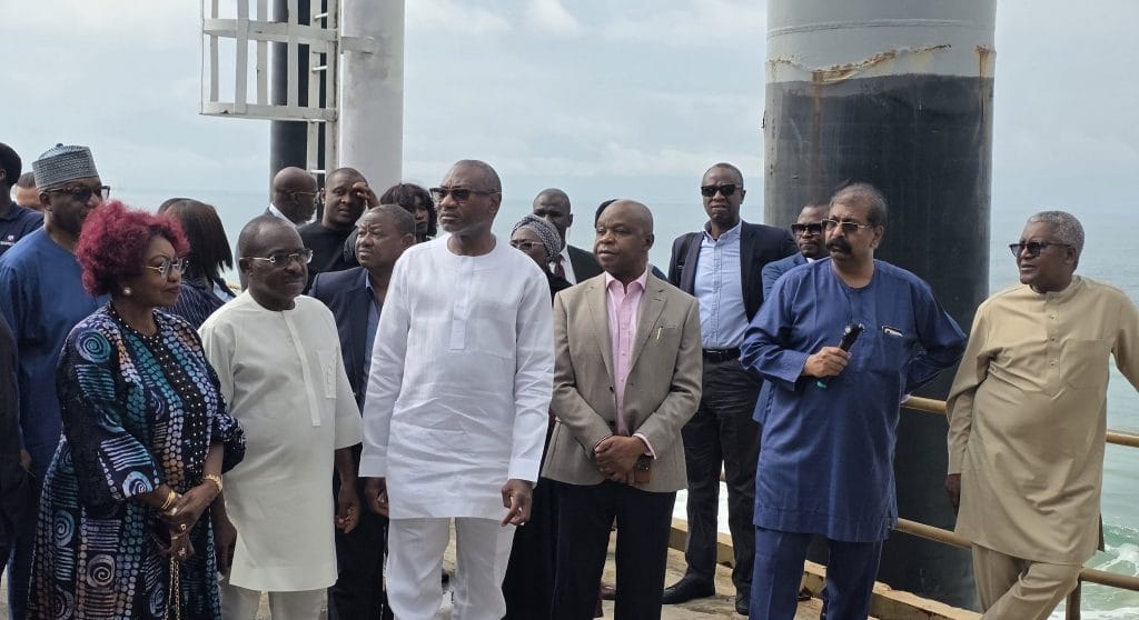 Aliko Dangote, Femi Otedola, and First HoldCo senior executives pose together at the Dangote Refinery.