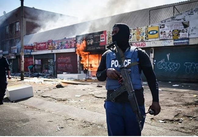 South African anti-migrant protesters march after Ramaphosa warns vigilantes