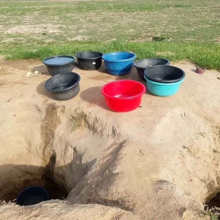 Residents of Ruwaza community fetching unsafe water from a shallow pit, as exposed by TrackaNG.