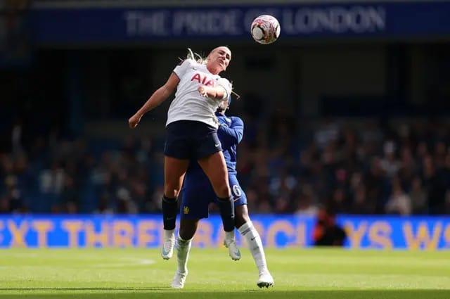 Cathinka Tandberg challenging for a header in a WSL game.
