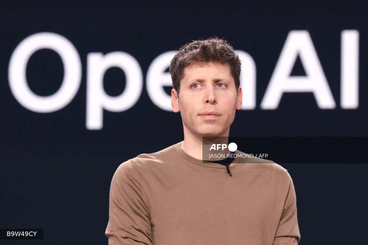OpenAI CEO Sam Altman speaking at a conference, whose company now faces a lawsuit from Apple.