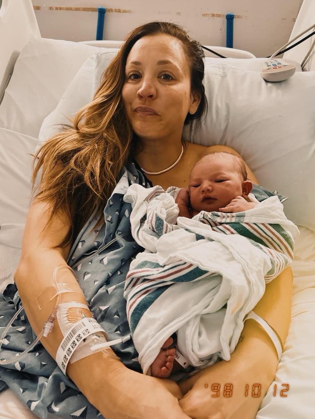 A close-up shot of Kaley Cuoco with her second child, Philomena.