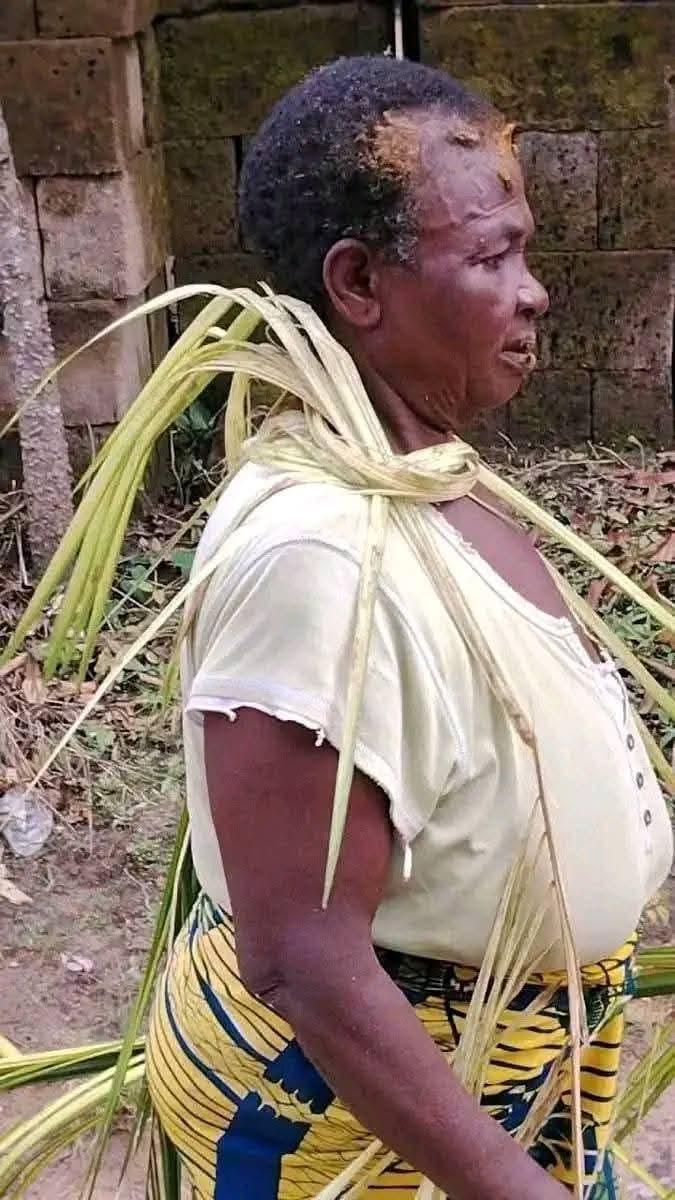 A scene from the viral video showing the elderly woman during her ordeal in the Enugu community.