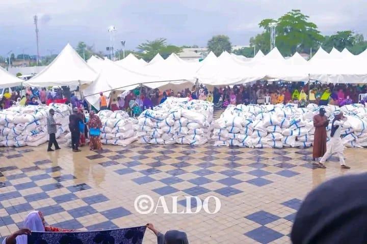Women receiving cassava as part of the empowerment initiative