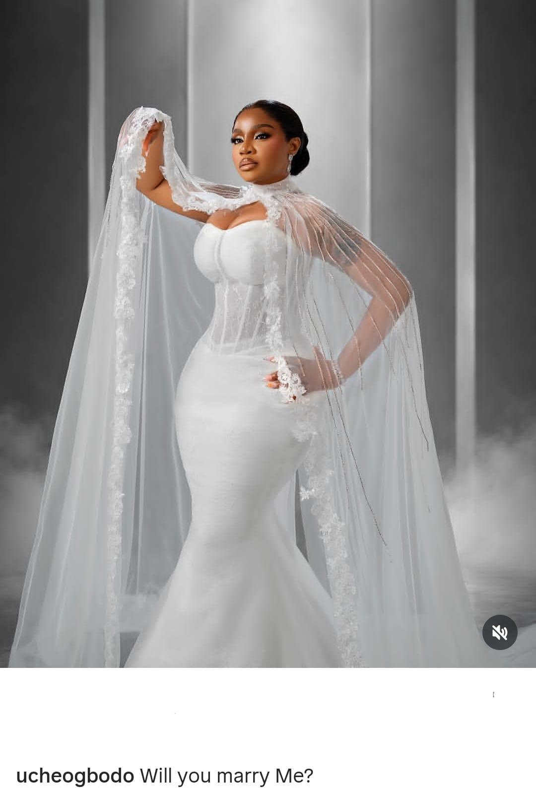 Uche Ogbodo reflecting on her past in a wedding ensemble.