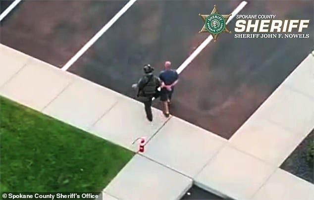 Convicted felon Aaron F Farinacci being taken into custody