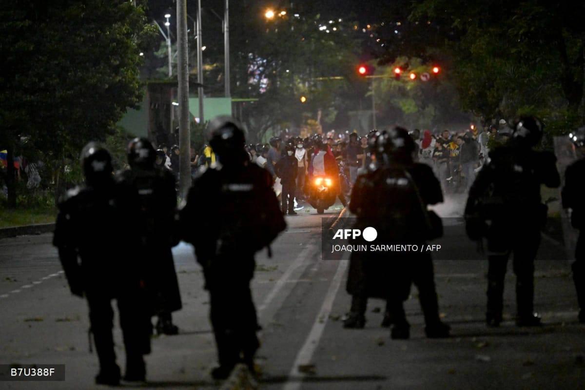 Riot police confronting protesters in Cali, Colombia, on June 21, 2026, as anger mounts over the preliminary results of the presidential runoff election.