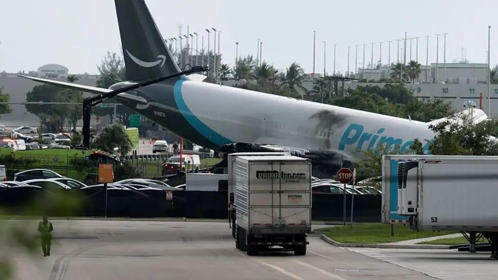 Wreckage and debris from the Amazon Air cargo plane crash at Miami International Airport.