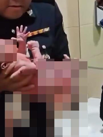 A closer view of the newborn baby found in the airport toilet's sanitary bin.