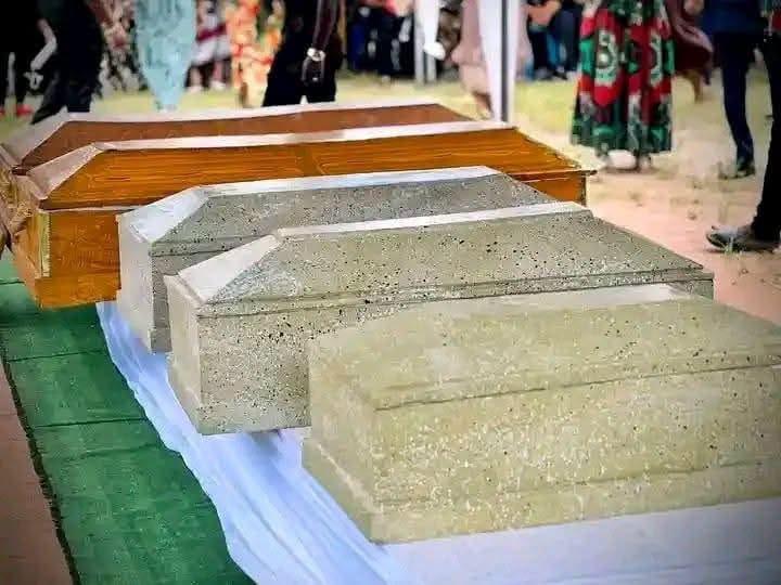 A solemn moment during the burial ceremony for the family of five in Isiala Ngwa North.
