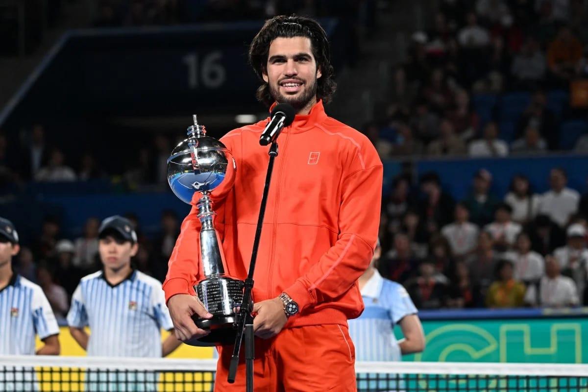 Spain's Carlos Alcaraz proudly holding the Japan Open trophy after his victory against Jiri Lehecka in Tokyo on October 6, 2026.