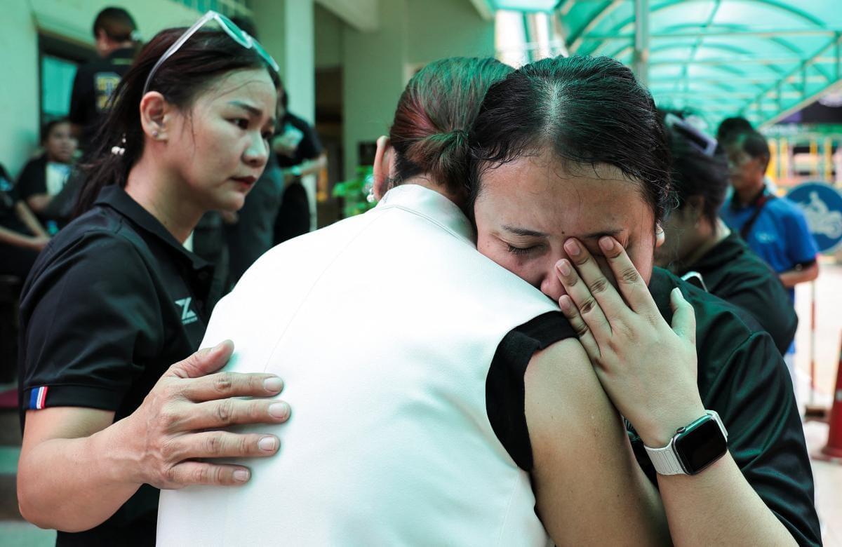 A teacher being attended to by a medic after the shooting