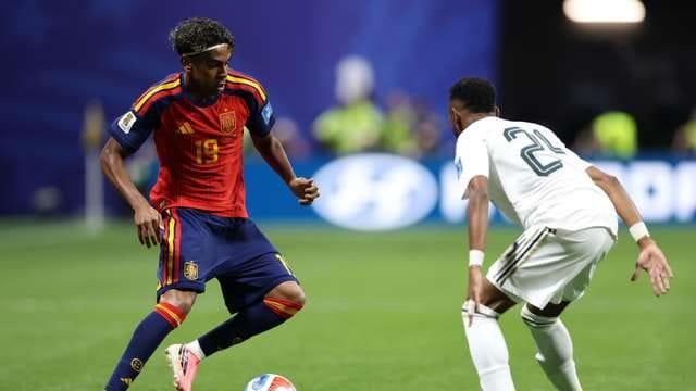 A Spanish national team player in focus during a football match.