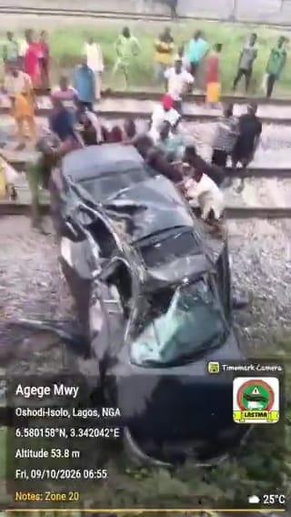 Emergency responders and traffic officials at the scene of the train-car collision in Lagos.