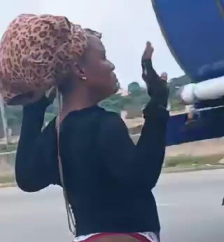 Bizarre Scene in Abuja: Woman Exhibiting Strange Behaviour Found on Roadside