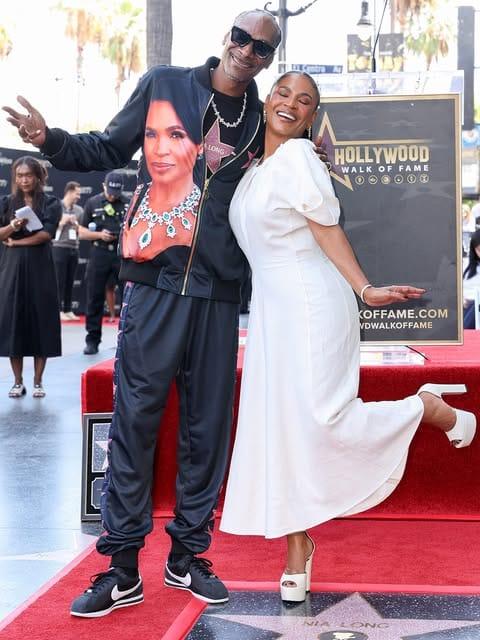 Snoop Dogg giving a heartfelt speech honouring Nia Long's enduring career.
