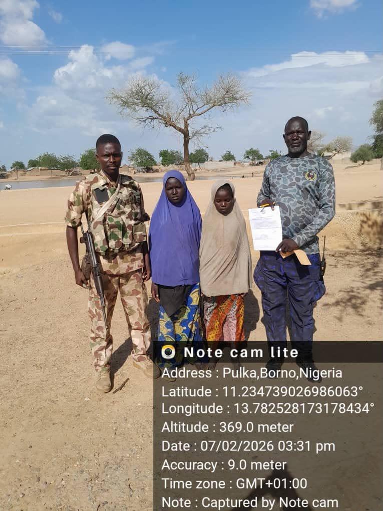 A group of young girls in a community setting, representing victims of abduction reunited with their families.