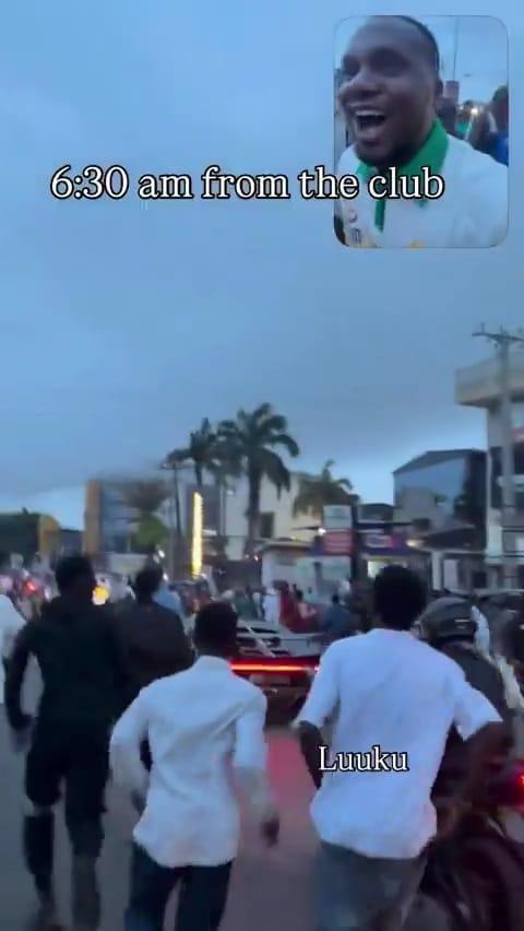 Youths running dangerously close to Burna Boy's vehicle, attempting to get money.