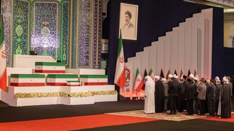 Iran's tricolour flag drapes the coffin of Supreme Leader Ali Khamenei during the pre-funeral ceremony in Tehran.