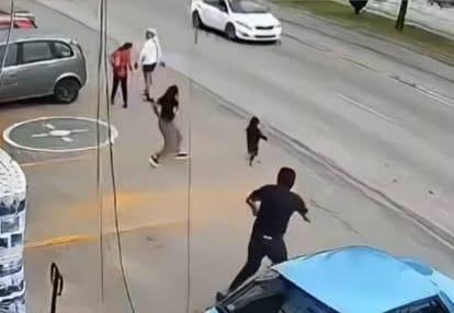 A store worker sprints towards the child to intervene as danger approaches.