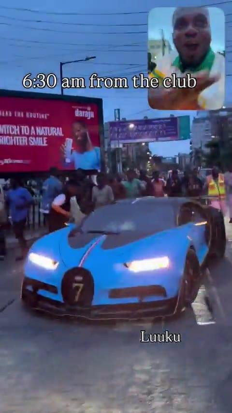 A crowd of young men pursuing Burna Boy's Bugatti on a Lagos street.