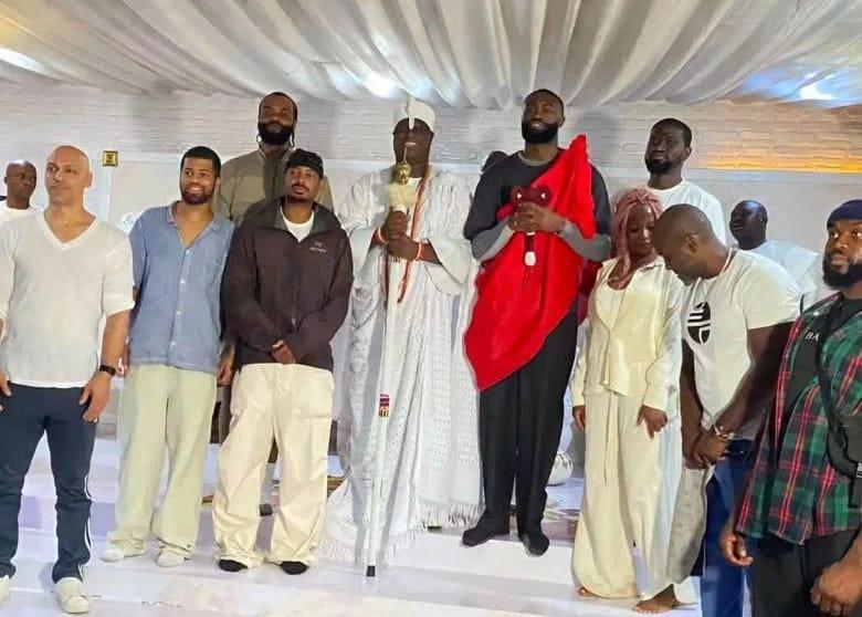 NBA star Jaylen Brown being formally received by the Ooni of Ife and palace officials.