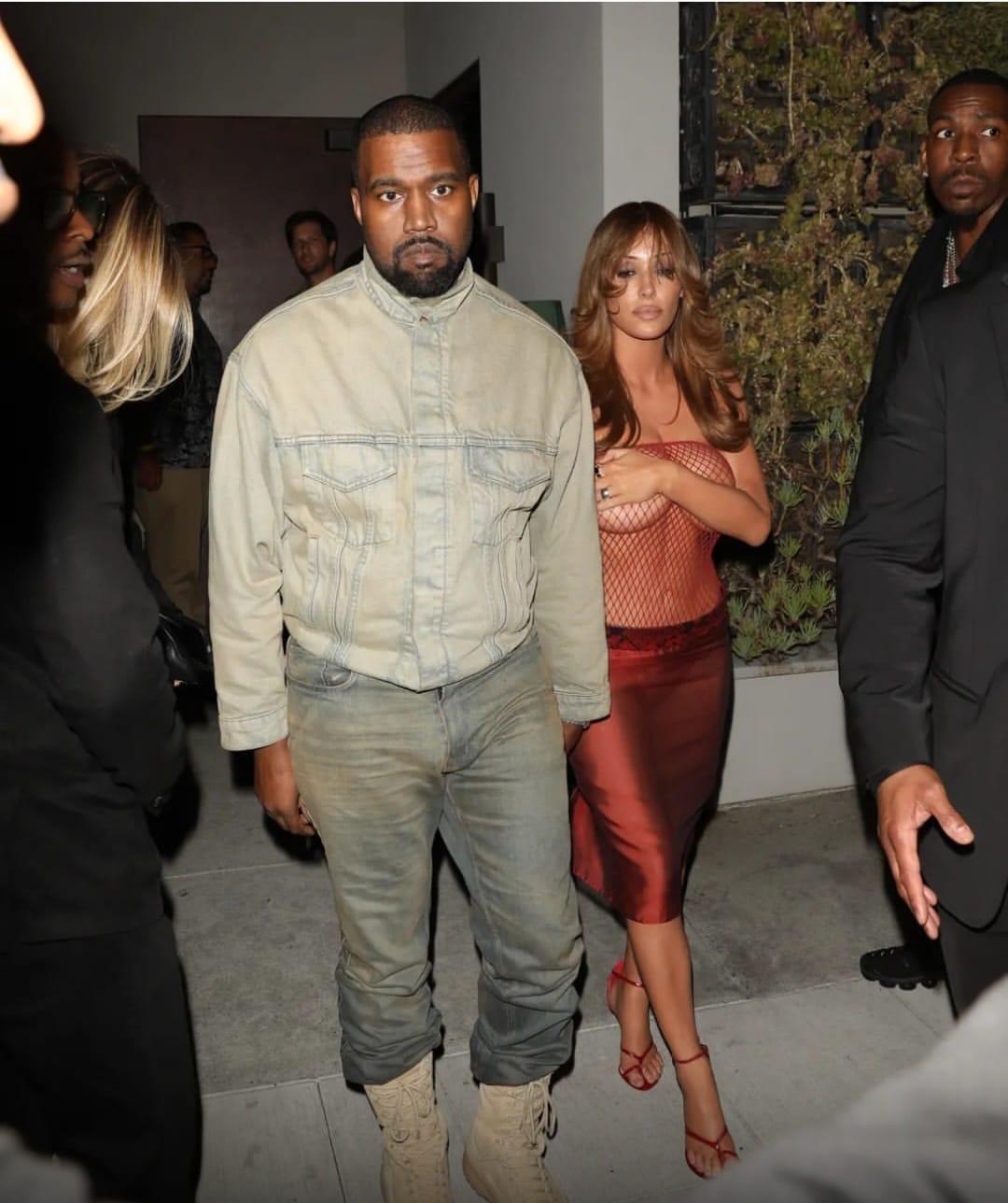 Bianca Censori spotted in a transparent mesh dress, alongside Kanye West.