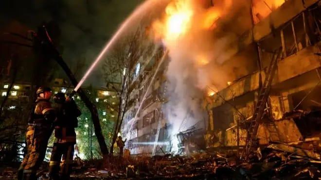Firefighters working to extinguish a fire in a building.