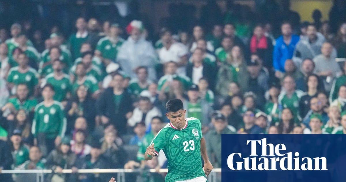 Jarell Quansah slides into a challenge on Jesús Gallardo during England’s victory over Mexico at the Azteca Stadium.