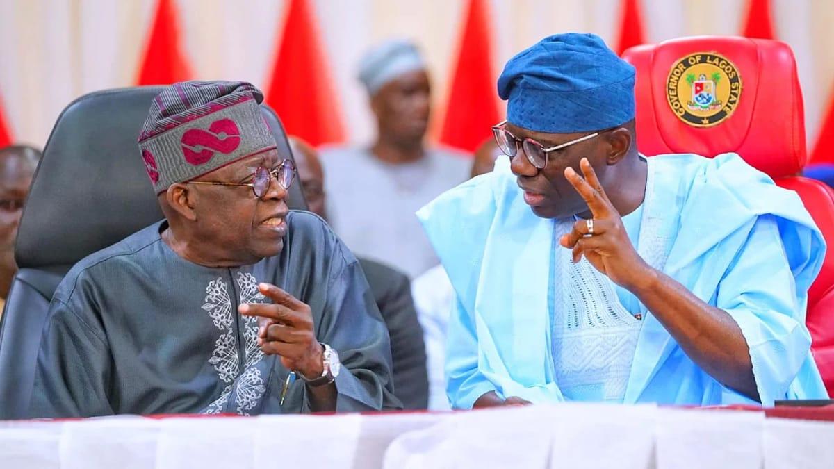 President Bola Tinubu and Governor Babajide Sanwo-Olu engaging during a public gathering.