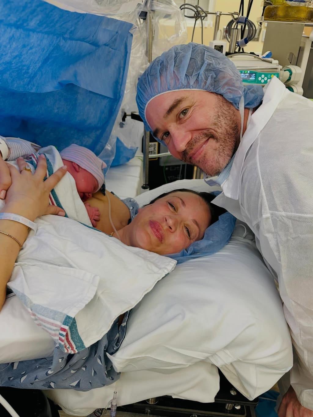 Kaley Cuoco and Tom Pelphrey share a tender moment with their new baby girl, Philomena Carmine Bobby Pelphrey.