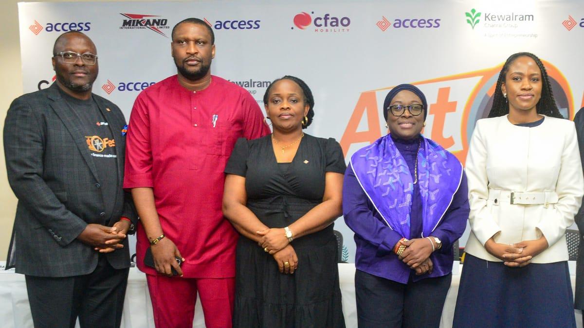 Key stakeholders from Access Bank and collaborating car dealerships posing with a vehicle at the AutoFest launch.