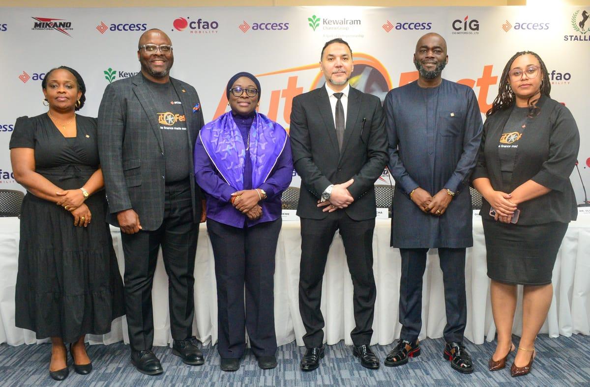 Access Bank officials engaging with attendees and showcasing vehicles at the AutoFest event.