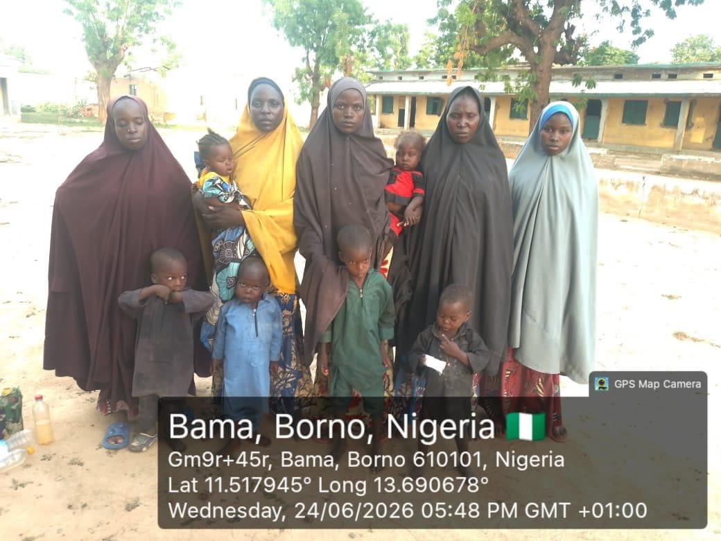 Surrendered individuals, including women and minors linked to Boko Haram, being processed by military personnel in Borno State.