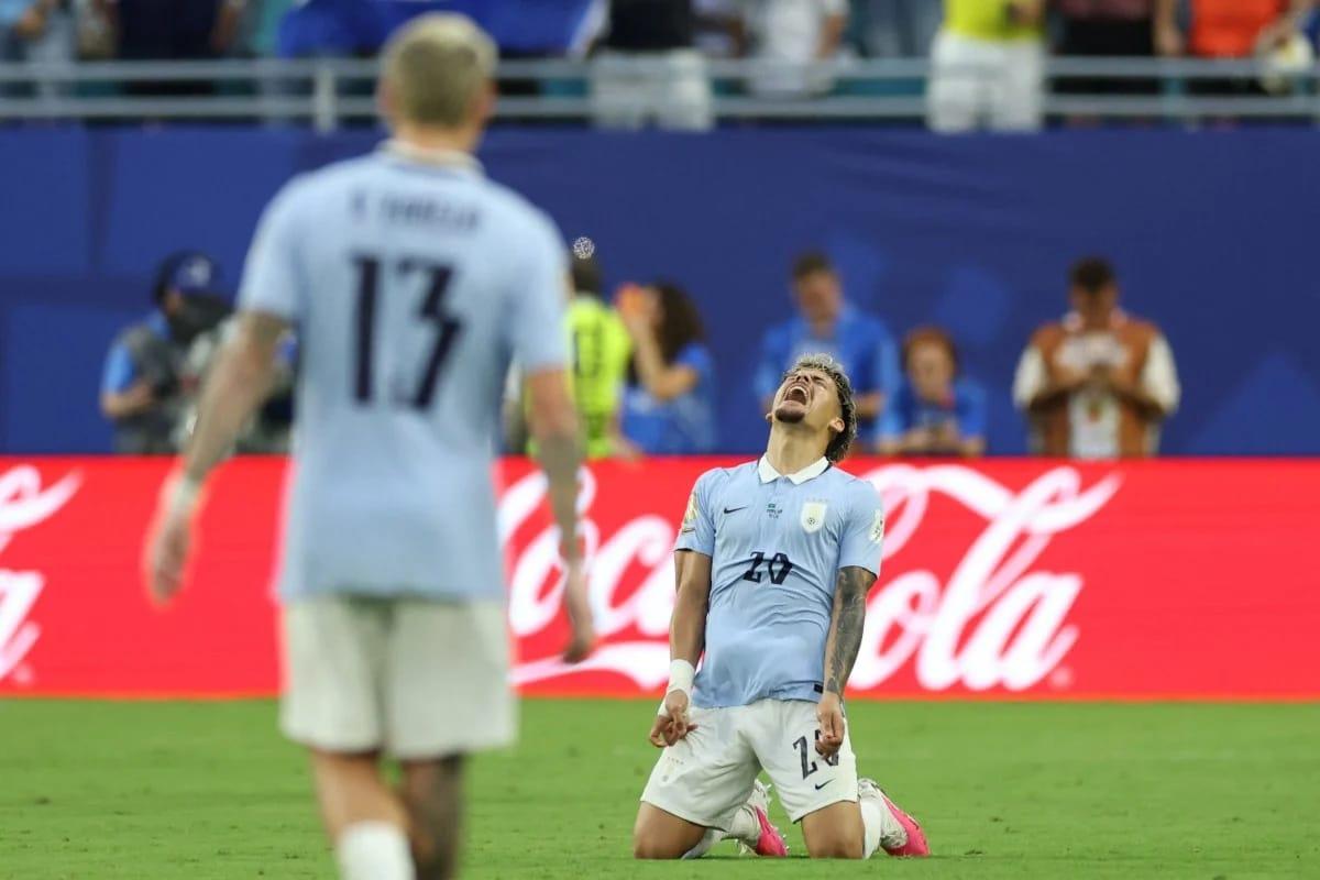 Uruguay's Maximiliano Araujo celebrates a goal in an earlier Group H match, a sentiment not repeated in their final game against Spain.