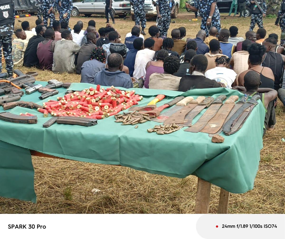 Recovered firearms and ammunition displayed alongside some suspected criminals apprehended during Operation Kosaye.
