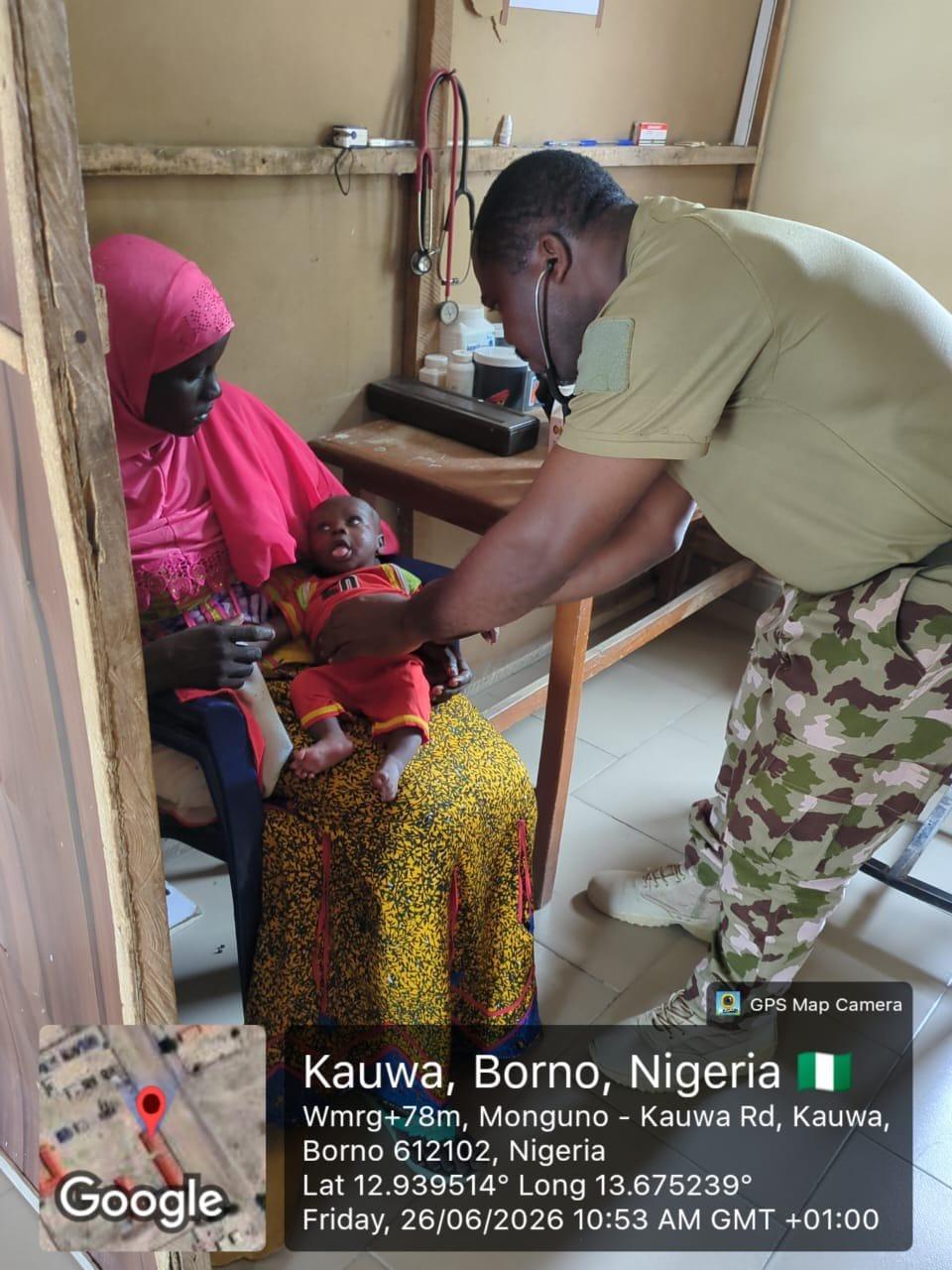 Falmata Bakwai, the ISWAP fighter's wife, seen with her infant following her surrender to military forces in Kukawa LGA, Borno.