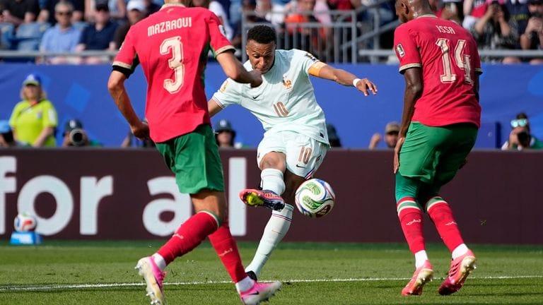 Kylian Mbappe scores the opening goal for France against Morocco in the World Cup quarter-final.