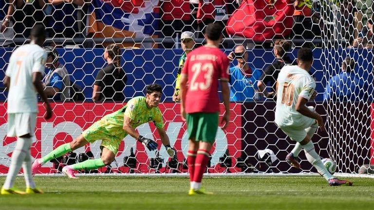Morocco's goalkeeper Yassine Bounou saves a penalty shot from France's Kylian Mbappe during their World Cup quarter-final match.