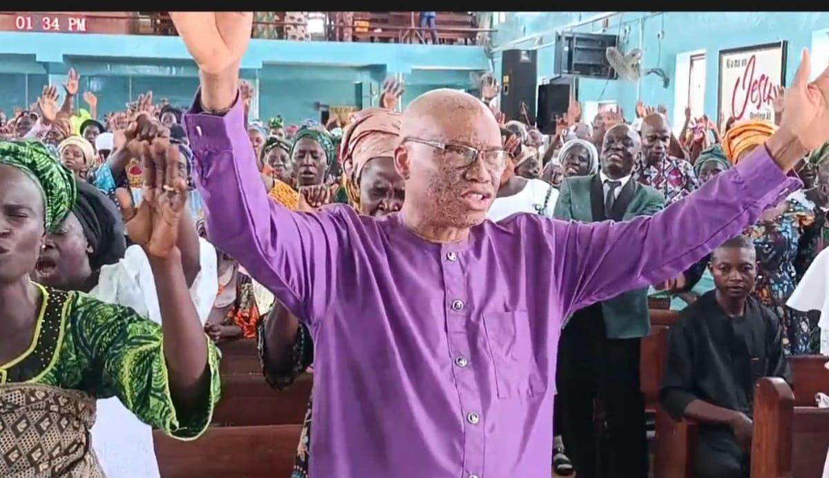 Professor Alamu dancing joyfully during the thanksgiving service.