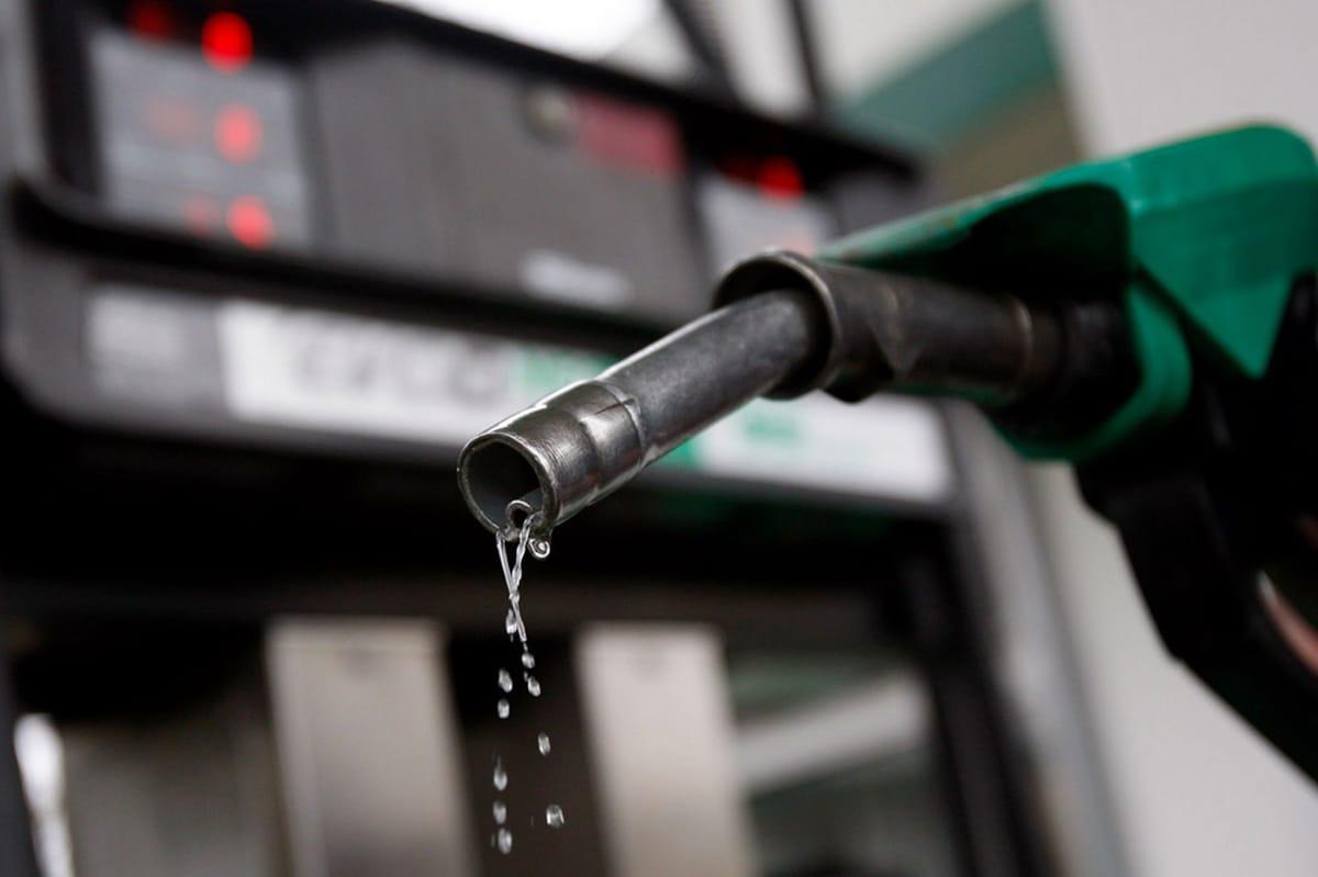 A sign displaying fuel prices at a Nigerian filling station, amidst ongoing price reductions.