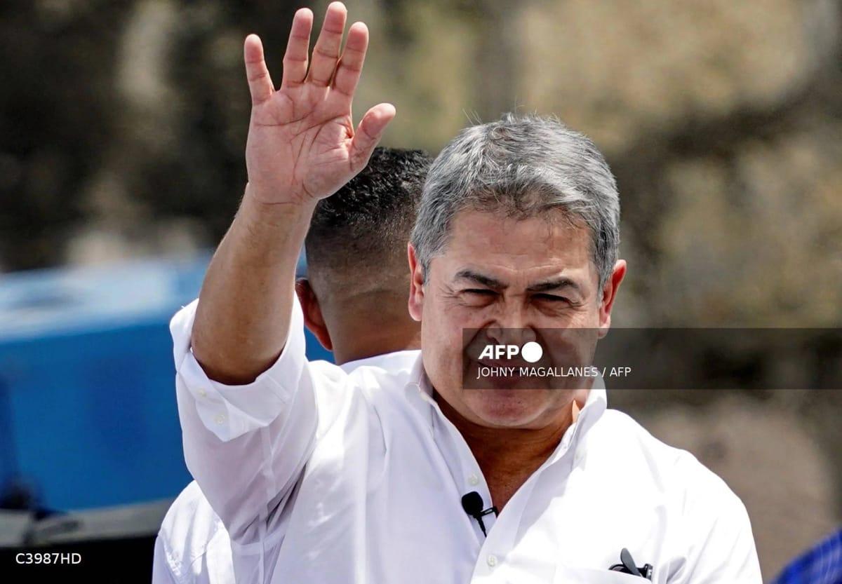 Former Honduran President Juan Orlando Hernandez waves to supporters at a welcome rally in Tegucigalpa, Honduras, on July 26, 2026.