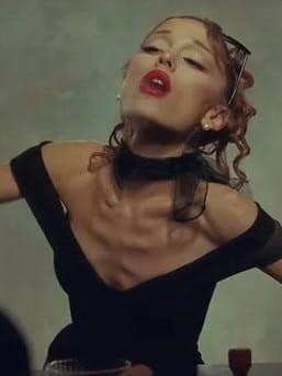 Ariana Grande performing on stage during her world tour