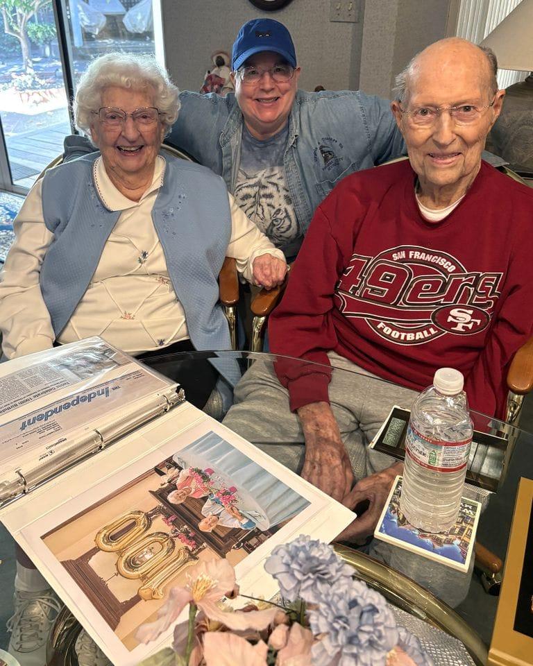 Jane and Bill with their family, including their primary caregiver, Nancy