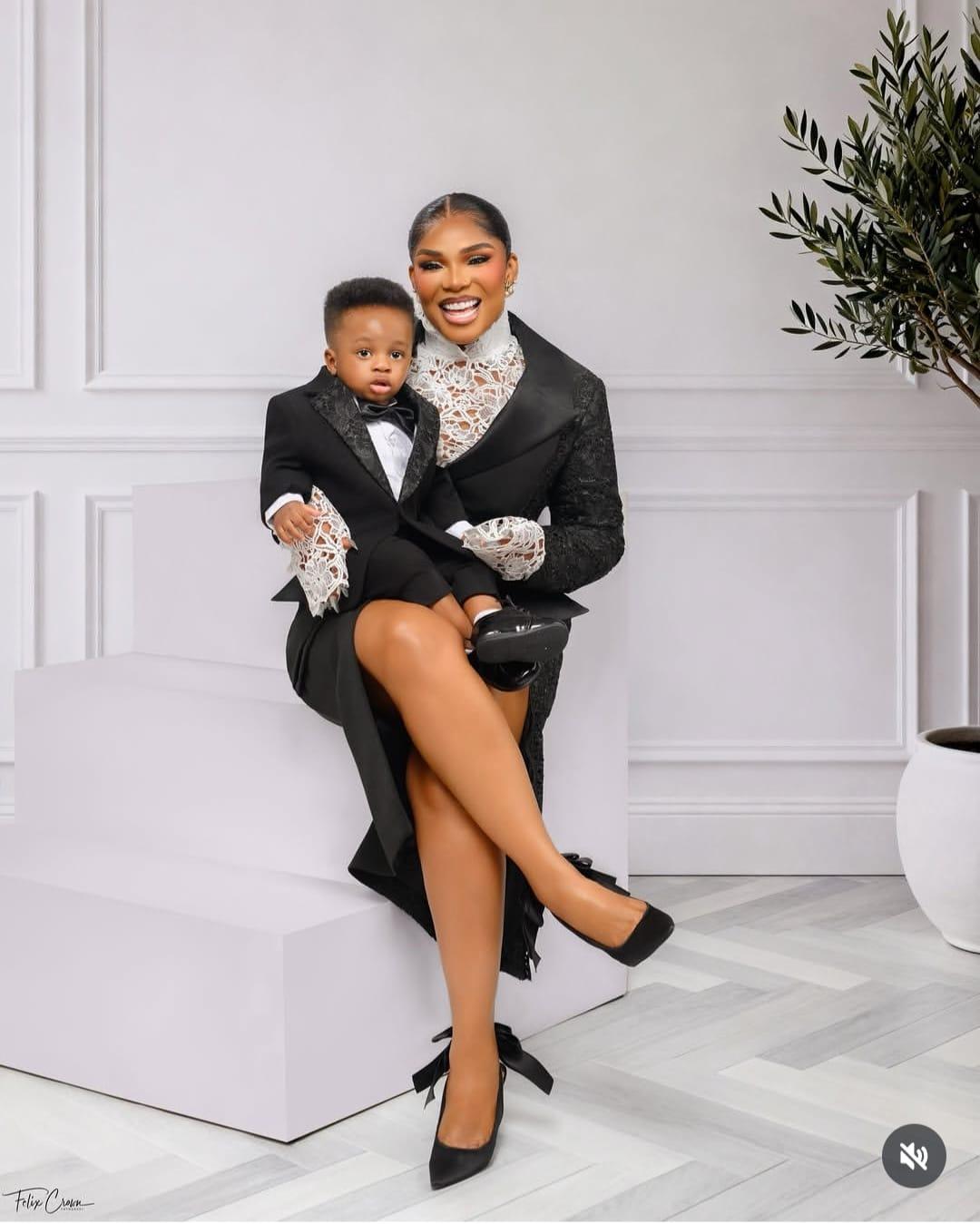 Iyabo Ojo and her grandson Rakeem in their coordinated black and white attire.