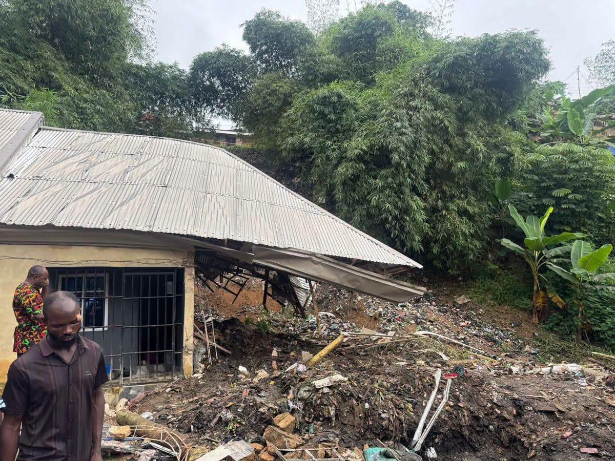 Emergency responders at the site of the collapsed refuse pile.