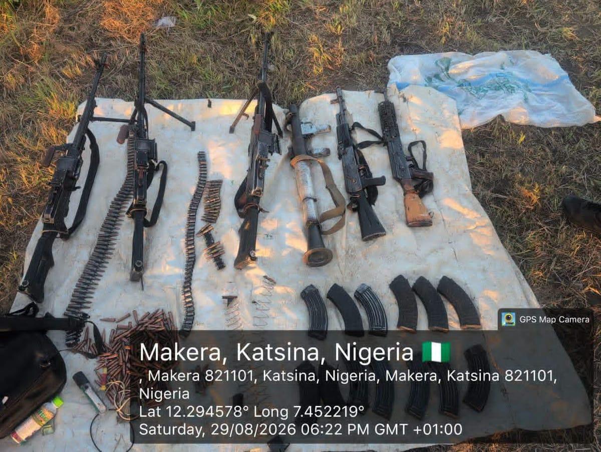 Military personnel inspecting recovered items after a successful operation against terrorists.