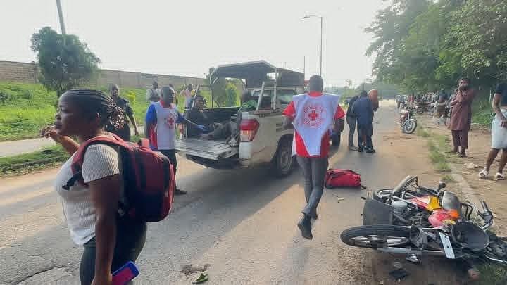Damaged vehicles and motorcycle involved in the Ibadan road crash.