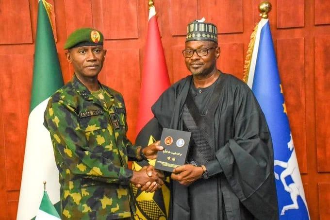 Kaduna State NYSC Coordinator, Mr. Abubakar Bawa, with GOC Major General Abubakar Sadique Wase during his visit.