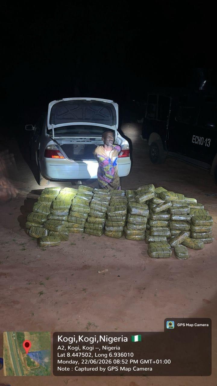 Troops displaying the large quantity of seized suspected cannabis.